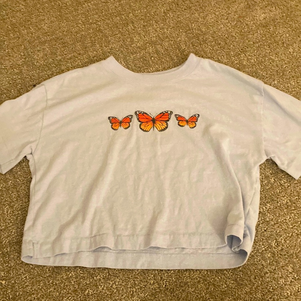 This is a butterfly shirt that is cropped and is great for anytime wear!!